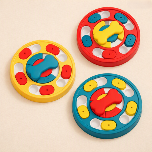 Dog puzzle feeder in red, blue and yellow laid out as gift ideas