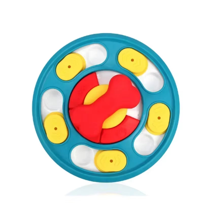 Dog puzzle feeder in blue with yellow sliding covers and a red bone-shaped centre, on a white background.