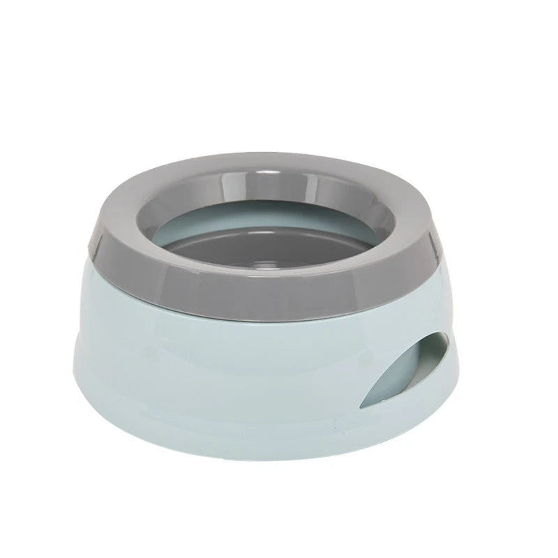 No-spill dog water bowl in pale blue with grey rim, on a white background